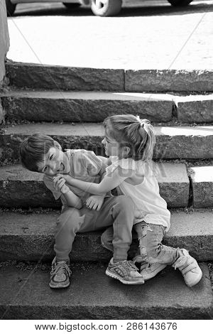 Small Girl And Boy On Stairs. Relations. Summer Holiday And Vacation. Childhood First Love. Couple O