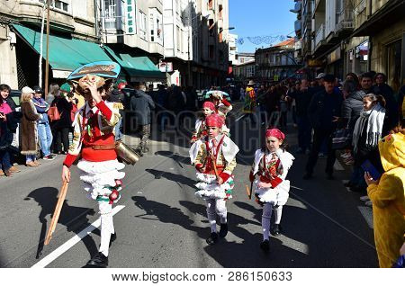 Verin, Spain, 24 Feb 2019. Famous Carnival And Street Parade With Cigarrons Costumes. Ourense Provin
