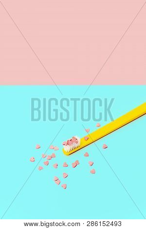 Love Concept Minimal. Bright Colorful Background With Teethbrush And Candy Hearts In Pink And Turquo