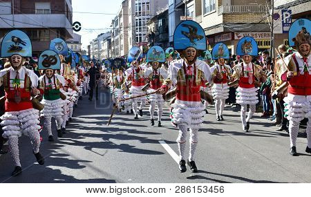 Verin, Spain, 24 Feb 2019. Famous Carnival And Street Parade With Cigarrons Costumes. Ourense Provin