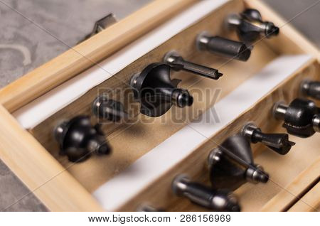 Set Of Steel Router Bit For Milling Cutter In Rectangle Wooden Box With Metal Lock On Old Broken Wor