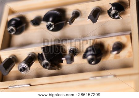 Set Of Steel Router Bit For Milling Cutter In Rectangle Wooden Box With Metal Lock On Old Broken Wor