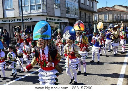 Verin, Spain, 24 Feb 2019. Famous Carnival And Street Parade With Cigarrons Costumes. Ourense Provin