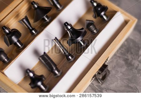 Set Of Steel Router Bit For Milling Cutter In Rectangle Wooden Box With Metal Lock On Old Broken Wor