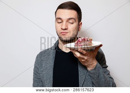 Closeup Portrait Young Cute Caucasian Man Holding White Round Plate With Piece Of Biscuit Cake, Prep