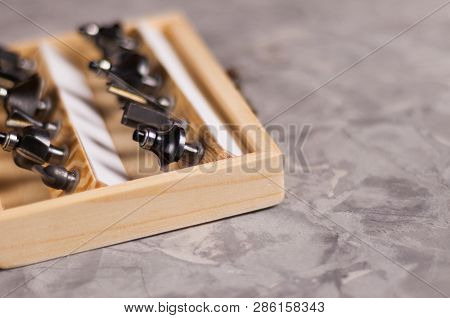 Set Of Steel Router Bit For Milling Cutter In Rectangle Wooden Box With Metal Lock On Old Broken Wor