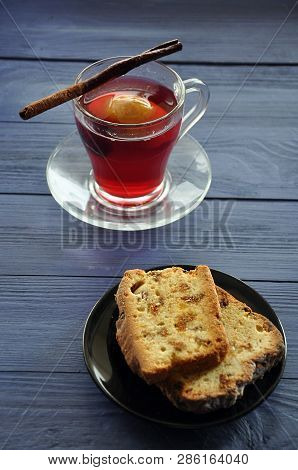 Homemade Ginger Cake With Raisins On The Black Plate And The Apple-dewberry Kompot (compote) - Popul