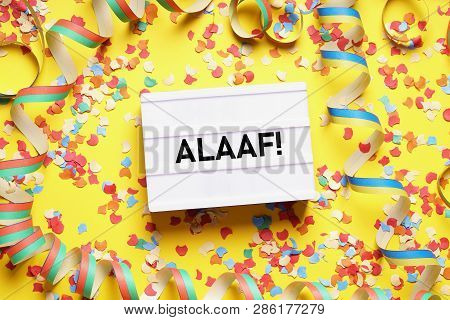 Alaaf Is The Traditional German Fools Call Used During Carnival In Cologne - Flat Lay With Confetti 