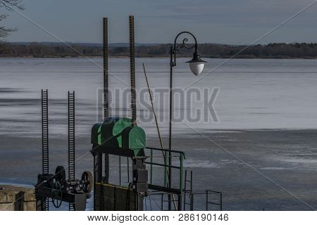 Nice Sunny Winter Cold Day Near Rozmberk Pond In South Bohemia With Lamp And Water Gate