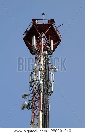 Communication Tower 3g Or 4g Network Telephone Cellsite Silhouette On Blue Sky. Implementation Of Co