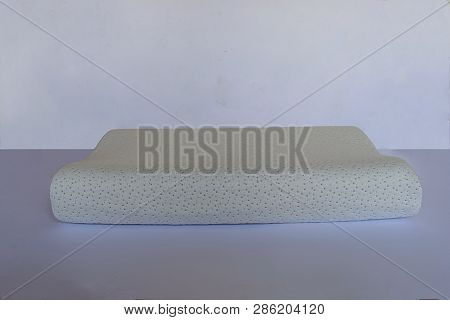 Modern Pillow On A Foam Base On A Light Background Close-up.