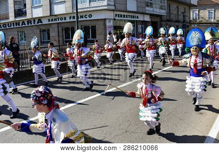 Verin, Spain, 24 Feb 2019. Famous Carnival And Street Parade With Cigarrons Costumes. Ourense Provin