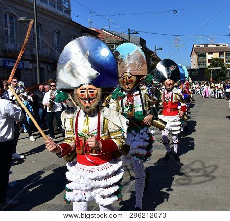 Verin, Spain, 24 Feb 2019. Famous Carnival And Street Parade With Cigarrons Costumes. Ourense Provin