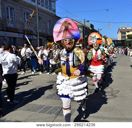 Verin, Spain, 24 Feb 2019. Famous Carnival And Street Parade With Cigarrons Costumes. Ourense Provin