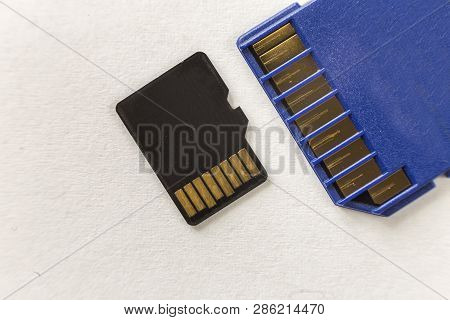 Close-up Of Micro Sd Memory Card And Sd Adapter Isolated On White Copy Space Background. Modern Tech