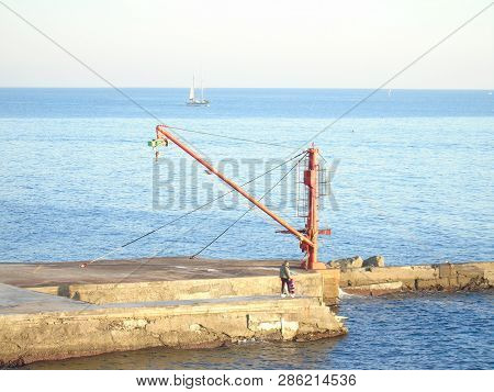 Genova, Italy - 02/14/2019: An Amazing Caption Of The Sunset Over The Sea And The City Of Genoa In W