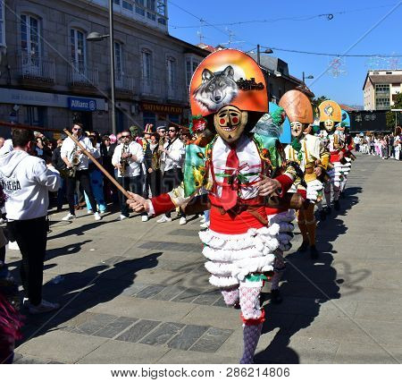 Verin, Spain, 24 Feb 2019. Famous Carnival And Street Parade With Cigarrons Costumes. Ourense Provin