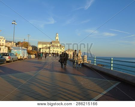 Genova, Italy - 02/14/2019: An Amazing Caption Of The Sunset Over The Sea And The City Of Genoa In W