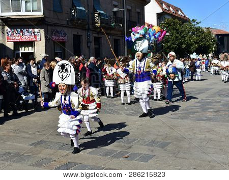 Verin, Spain, 24 Feb 2019. Famous Carnival And Street Parade With Cigarrons Costumes. Ourense Provin