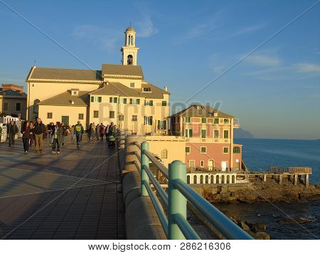 Genova, Italy - 02/14/2019: An Amazing Caption Of The Sunset Over The Sea And The City Of Genoa In W