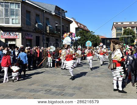 Verin, Spain, 24 Feb 2019. Famous Carnival And Street Parade With Cigarrons Costumes. Ourense Provin