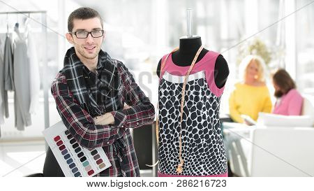 Creative Fashion Designer Standing In His Studio