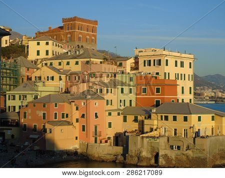 Genova, Italy - 02/14/2019: An Amazing Caption Of The Sunset Over The Sea And The City Of Genoa In W