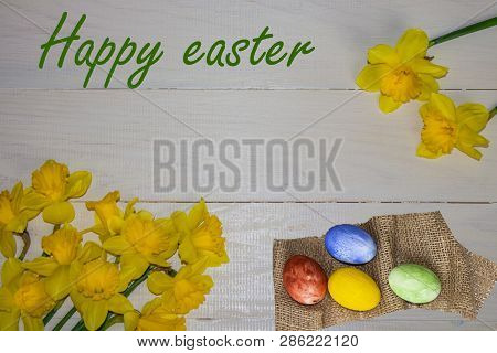 Easter Eggs And Daffodils. Happy Easter Card. Colorful Easter Eggs And Fresh Spring Daffodils.decora