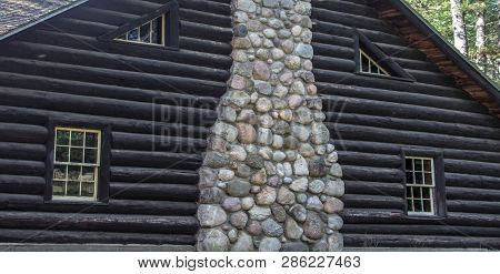 Log Cabin Lodge. Exterior Wall And Chimney Of Historic Log Cabin Lodge Built By The Ccc And Located 