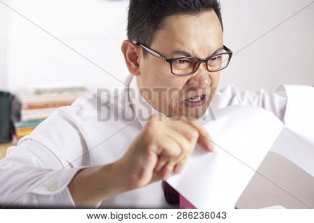 Angry Businessman Rip Off Contract Paper