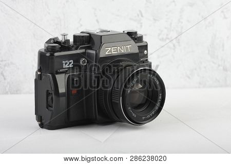 Moscow, Russia, February 26, 2019. The Old Soviet 35 Mm Slr Camera Zenit 122, Released 1993, On Gray