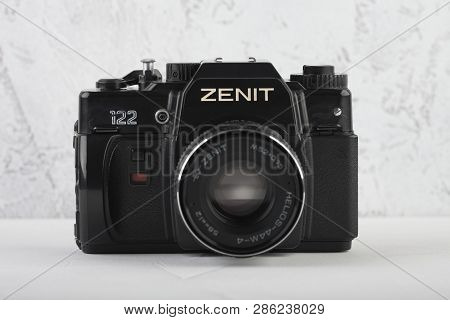 Moscow, Russia, February 26, 2019. The Old Soviet 35 Mm Slr Camera Zenit 122, Released 1993, On Gray
