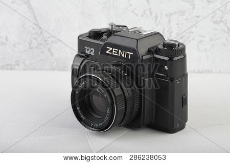 Moscow, Russia, February 26, 2019. The Old Soviet 35 Mm Slr Camera Zenit 122, Released 1993, On Gray