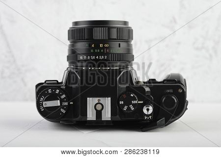 Moscow, Russia, February 26, 2019. The Old Soviet 35 Mm Slr Camera Zenit 122, Released 1993, On Gray