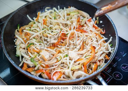 Japanese Ramen Soup With Chicken, Egg, Chives And Sprout On Dark Wooden Background.