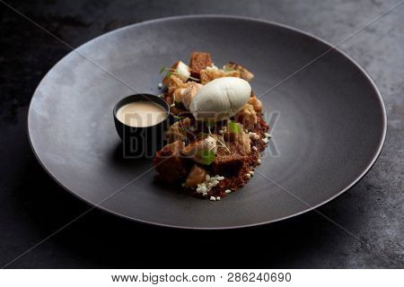 dessert with cake, fried banana, vanilla ice cream, toffee and vanilla sauce