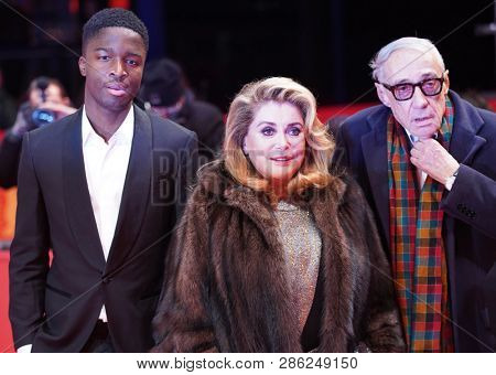 Stephane Bak, Catherine Deneuve, Andre Techine pose at the 'Farewell To The Night' premiere during the 69 Berlinale Festival  at Berlinale Palace on February 12, 2019 in Berlin, Germany.         