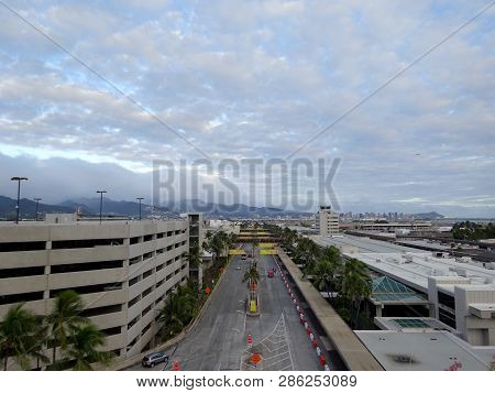 Honolulu - January 25, 2015: Aerial View Of Parking Lot, Terminal, And Roads Leading Into Airport At