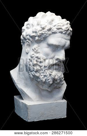 Bust Of The Farnese Hercules. Heracles Head Sculpture, Plaster Copy Of A Marble Statue Isolated On B