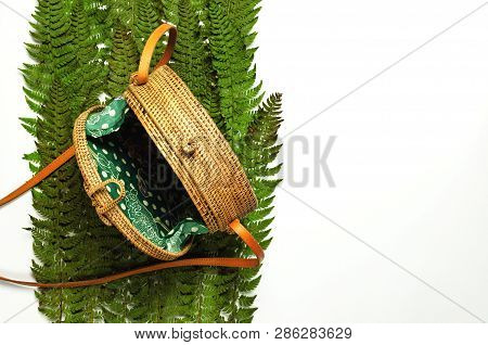 Fashionable Handmade Natural Organic Rattan Bag And Green Fern Leaves, Pink Flower Isolated On White