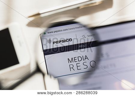 New York, Usa - 27 February 2019: Pepsico, Inc. Official Website Homepage Under Magnifying Glass. Co