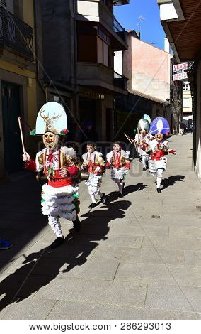 Verin, Spain, 24 Feb 2019. Famous Carnival And Street Parade With Cigarrons Costumes. Ourense Provin