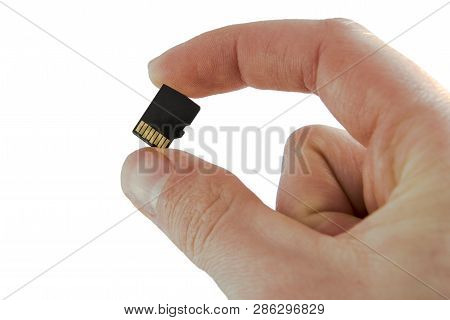 Memory Card With Two Fingers  Micro Sd Flash On White Background