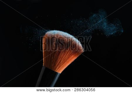 Cosmetic Brush On Black Background With Powder Or Shadows