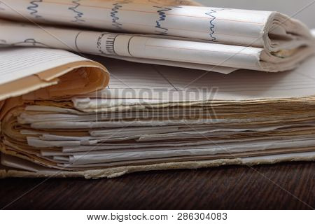 Old Medical Card Of The Disease. Medical Record Of The Patient. Manuscript On The Table. Old Written