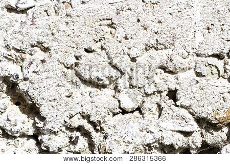 An Old Decrepid And Uneven White Wall Lodge. Concrete Texture. Cement  Background.
