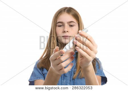 Teen Girl Using Lancet Pen On White Background. Diabetes Control