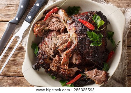 Slowly Cooked Shredded Pulled Pork Close-up On A Plate. Horizontal Top View
