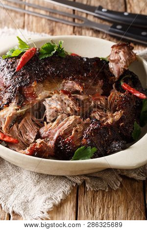 National Latin American Dish Of Pernil Asado Shredded Pork Closeup On A Plate. Vertical
