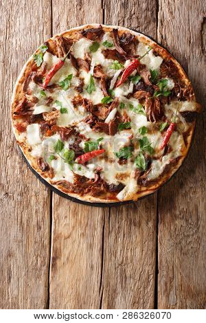 Fresh Pizza With Pulled Pork, Mozzarella Cheese, Chilli And Barbecue Sauce Close-up. Vertical Top Vi